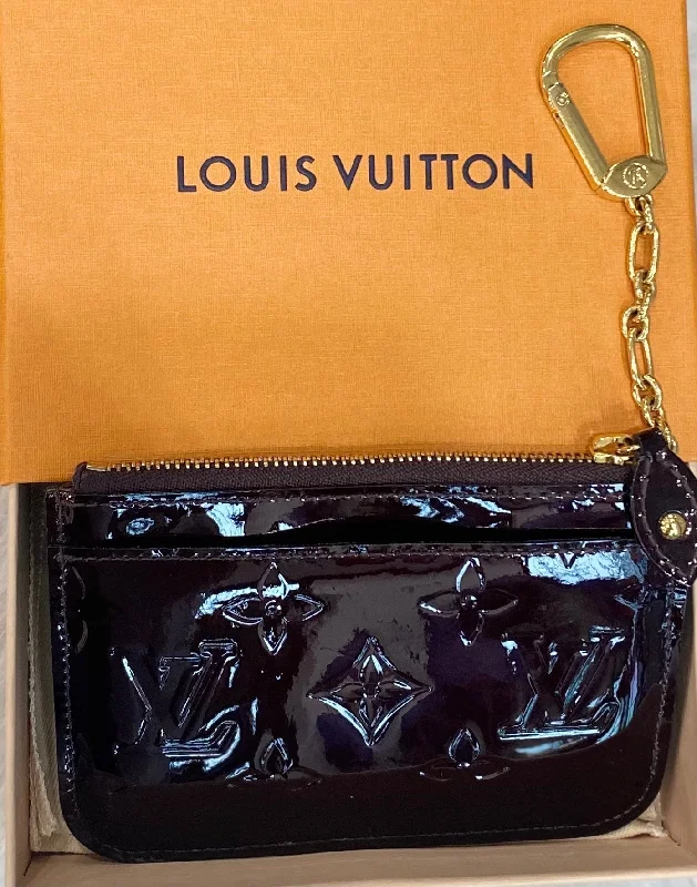 Louis Vuitton tote bags with a printed LV logo on the front for brand visibilityLOUIS VUITTON MONOGRAM VERNIS KEY POUCH