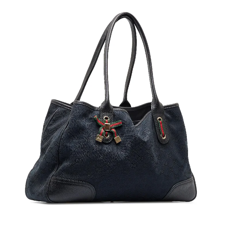 Women Gucci bags with a snap - button closure and a decorative charmGucci GG Canvas Princy Tote Bag (SHG-RgGUyG)